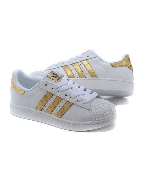 Adidas Superstar gold stripe